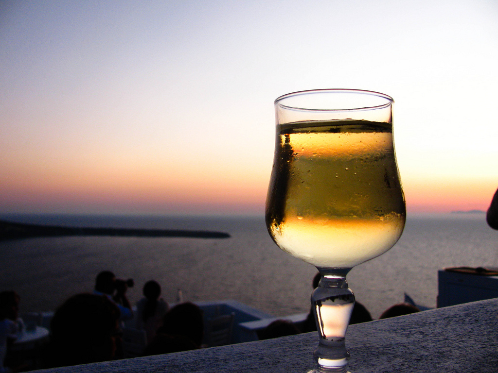 Enjoying Greek wine during sunset