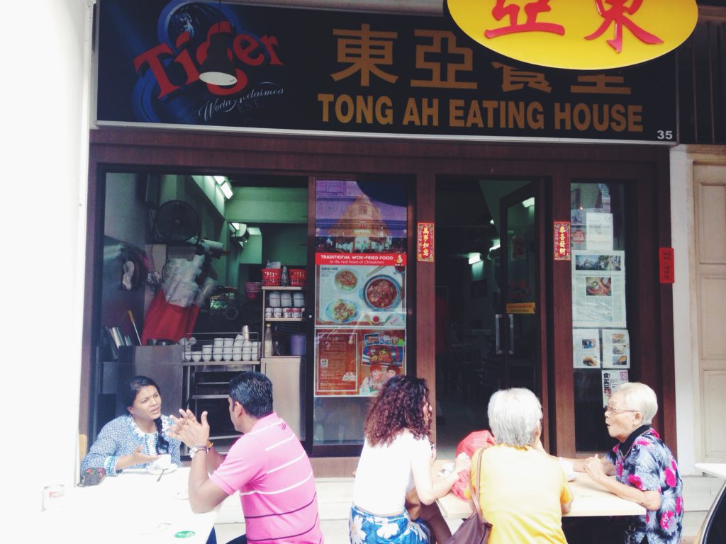 Regulars post up in sidewalk seats at Tong Ah