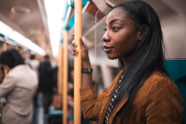 Young woman traveling with metro in London, UK.